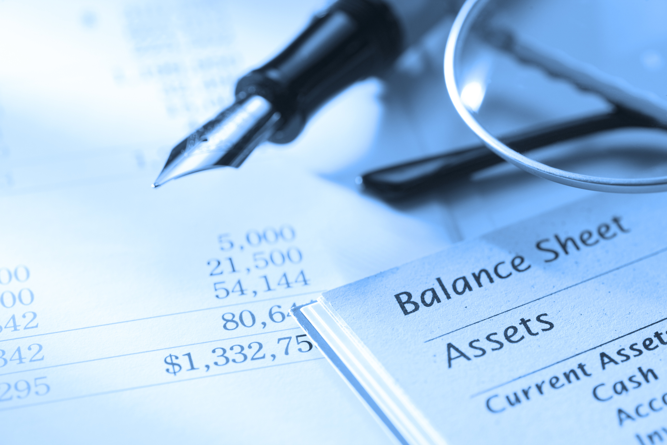 Close up of fountain pen on a balance sheet